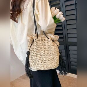 Elegant Cream Woven Bag with Black Tassels